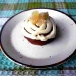 A plate with a vegan cupcake on it.