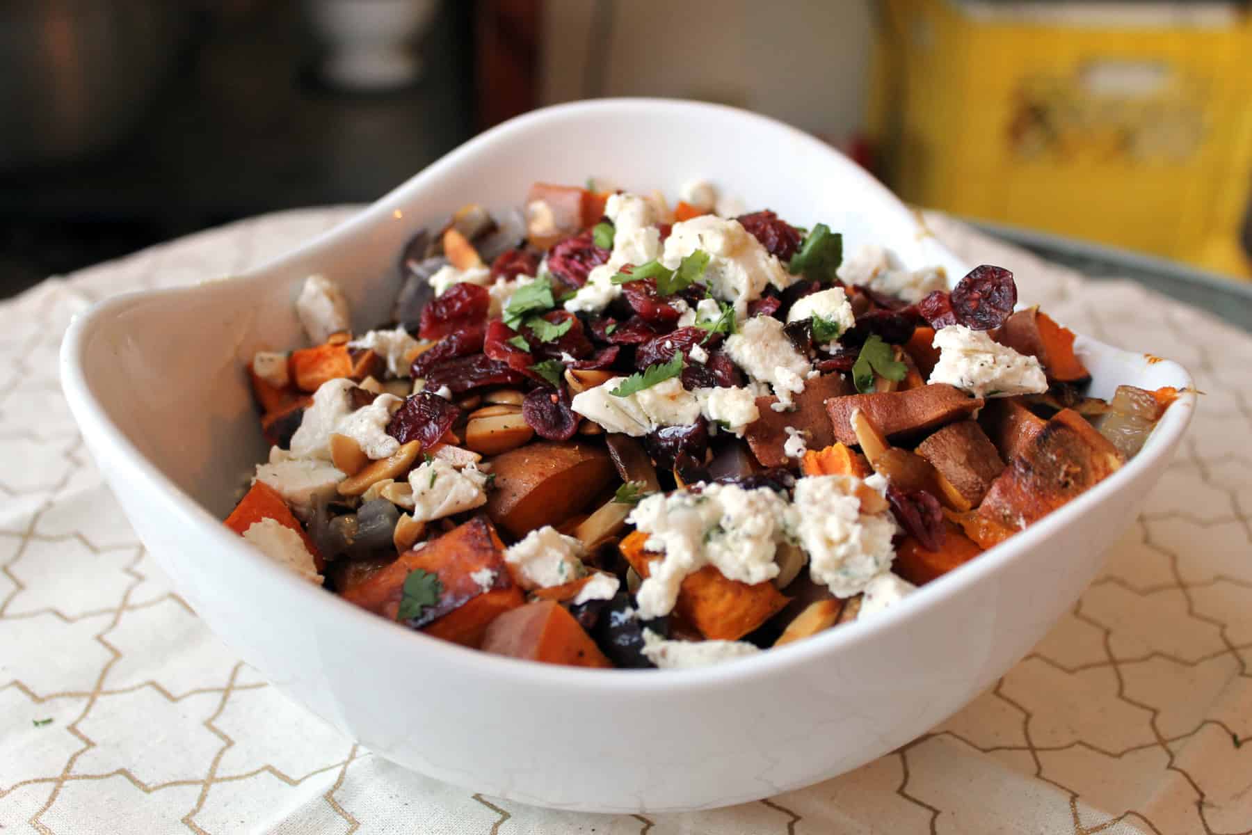 Roasted sweet potato salad with onions, cranberries and nuts