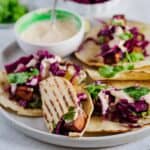 tacos on a plate with spicy mayo