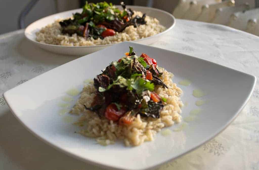swiss chard and tomatoes on rice