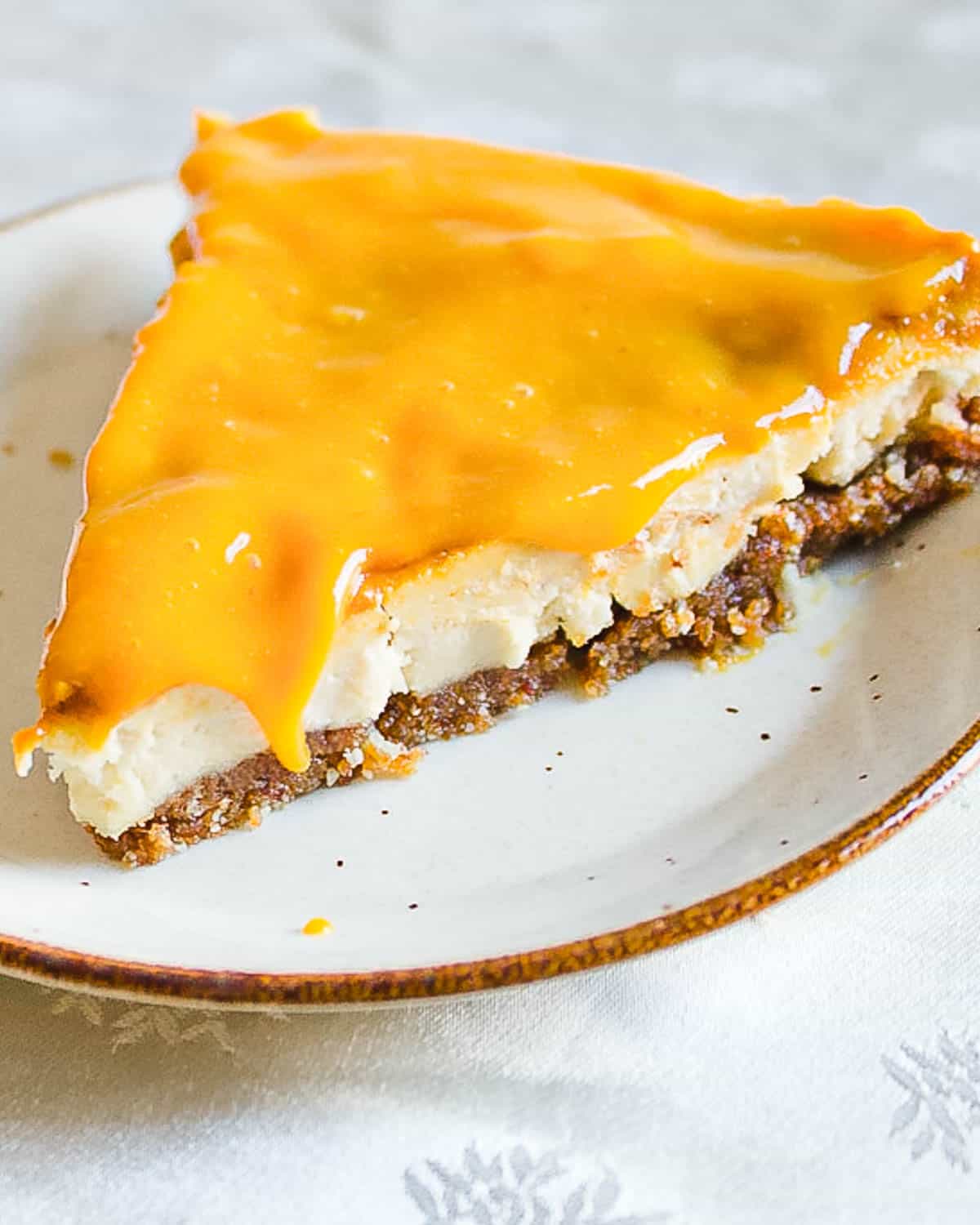 no bake vegan mango cheesecake slice on plate