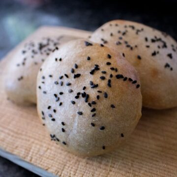 Three black sesame sourdough buns