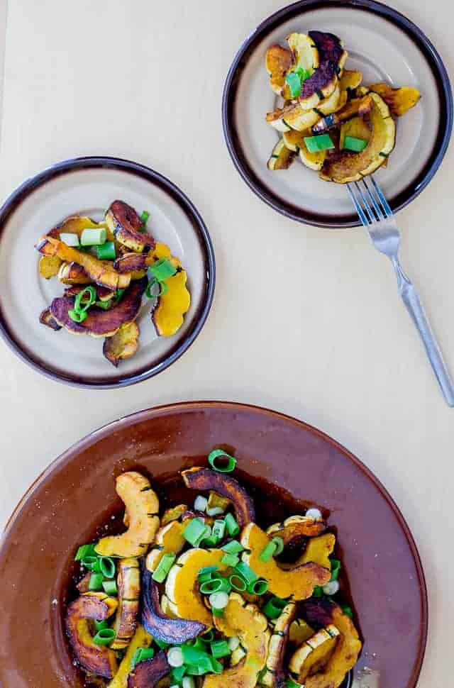 Roasted delicata squash salad with scallions and pumpkin seeds
