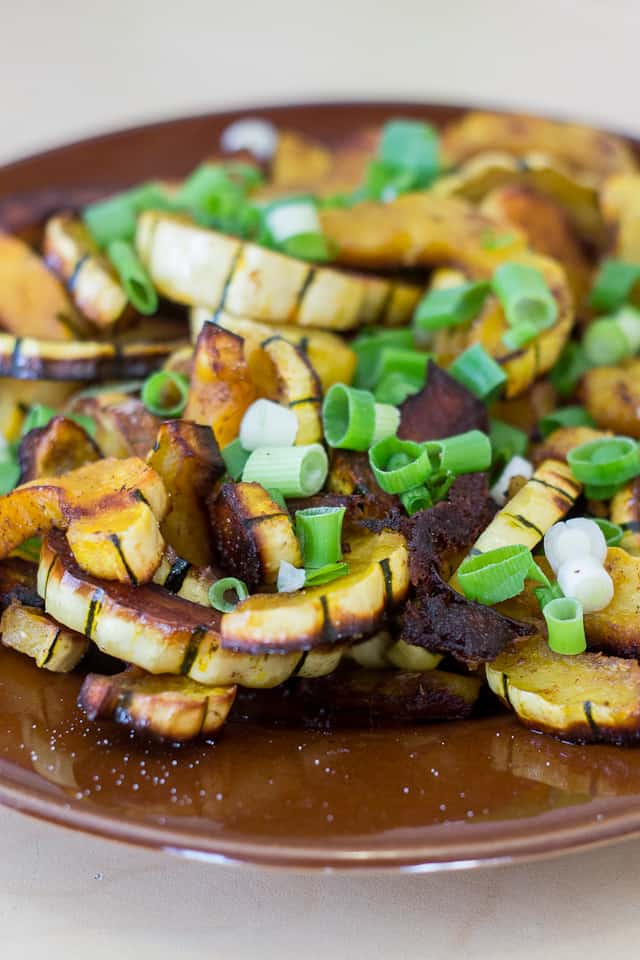 Roasted delicata squash salad with scallions and pumpkin seeds