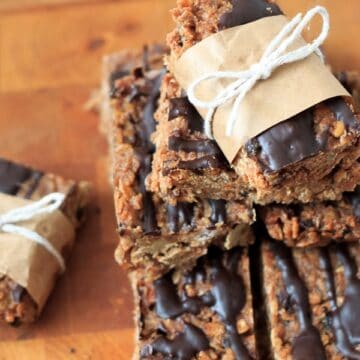 A decadent stack of chocolate covered granola bars.