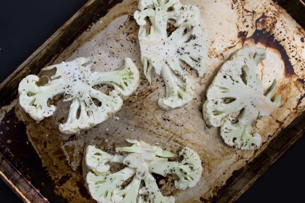 Roasted cauliflower steaks on spicy sweet potato puree