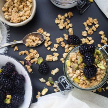 kiwi, lime and blackberry yogurt parfait with granola and pistachios