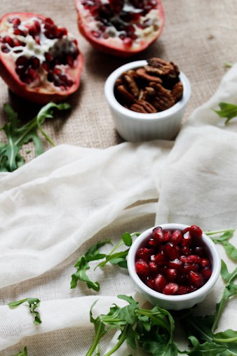 Endive and arugula provide the peppery bite to this arugula salad, while the milky fresh mozzarella brings creaminess, & the pomegranate and pecans the pop.