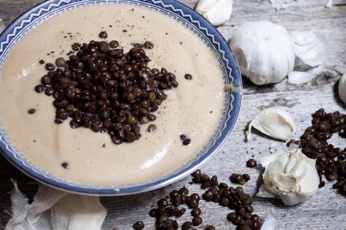 Celery root soup with roasted garlic and lentils is a heady, earthy affair that tastes light & intriguing. It also looks a lot like Thomas Keller's Oysters and Pearls.