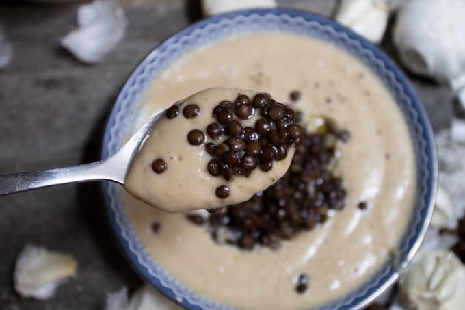 Celery root soup with roasted garlic and lentils is a heady, earthy affair that tastes light & intriguing. It also looks a lot like Thomas Keller's Oysters and Pearls.