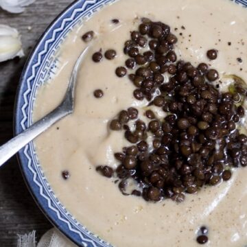 Celery root soup with roasted garlic and lentils is a heady, earthy affair that tastes light & intriguing. It also looks a lot like Thomas Keller's Oysters and Pearls.