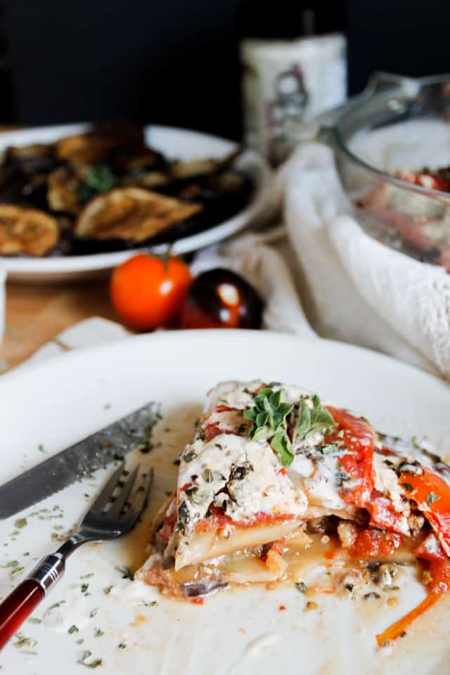 A lightened up version of a classic, this cold moussaka is layered with eggplant, potatoes and tomatoes, and served with tangy kalamata feta sauce.