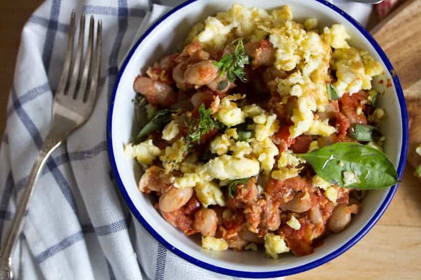 You simply can't stop eating these borlotti beans in tomato sauce with eggs. They're saucy, spicy and so meaty!