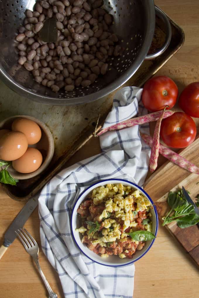 You simply can't stop eating these borlotti beans in tomato sauce with eggs. They're saucy, spicy and so meaty!