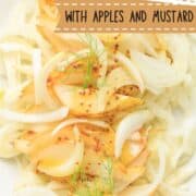 fennel and pear and apple salad on a white platter