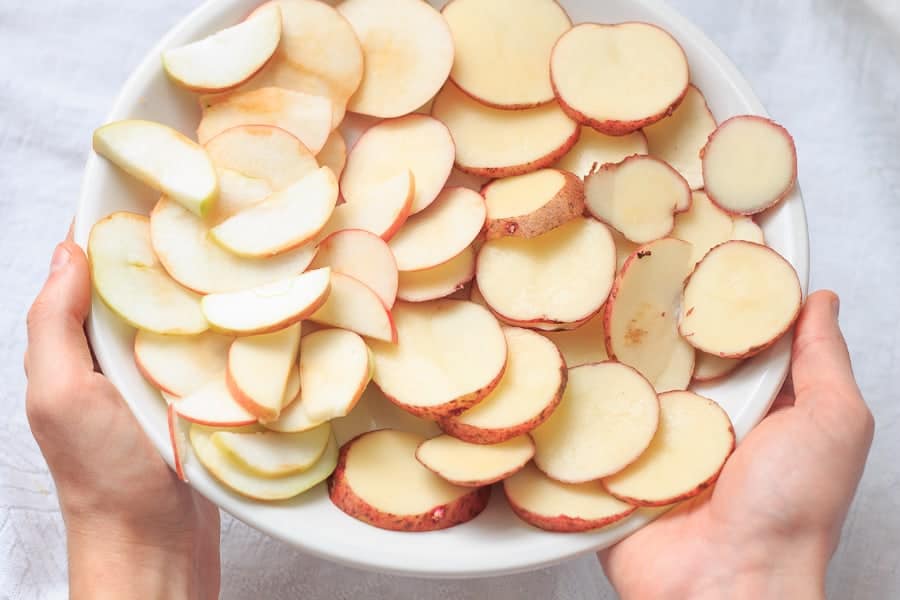 Dressed in spiced apple sauce and cooked to perfection, this roasted salmon rests on a bed of naturally sweet, caramelized apples and potatoes.