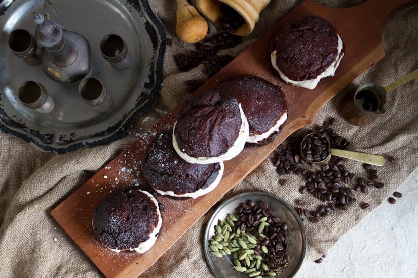 In these gluten-free sufganiyot with cardamom coffee cream, the coffee is paired with gently sweetened cream and piped into freshly fried Jewish donuts. 