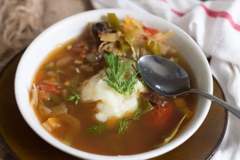 This Slovakian sauerkraut soup is tangy and rich in flavour, full of plump mushrooms and juicy strands of cabbage. A full winter meal!