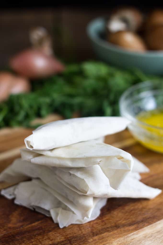 Mushroom bourekas are flaky phyllo dough pockets, filled with a salty, sweet and earthy mixture of mushrooms and caramelized onions.