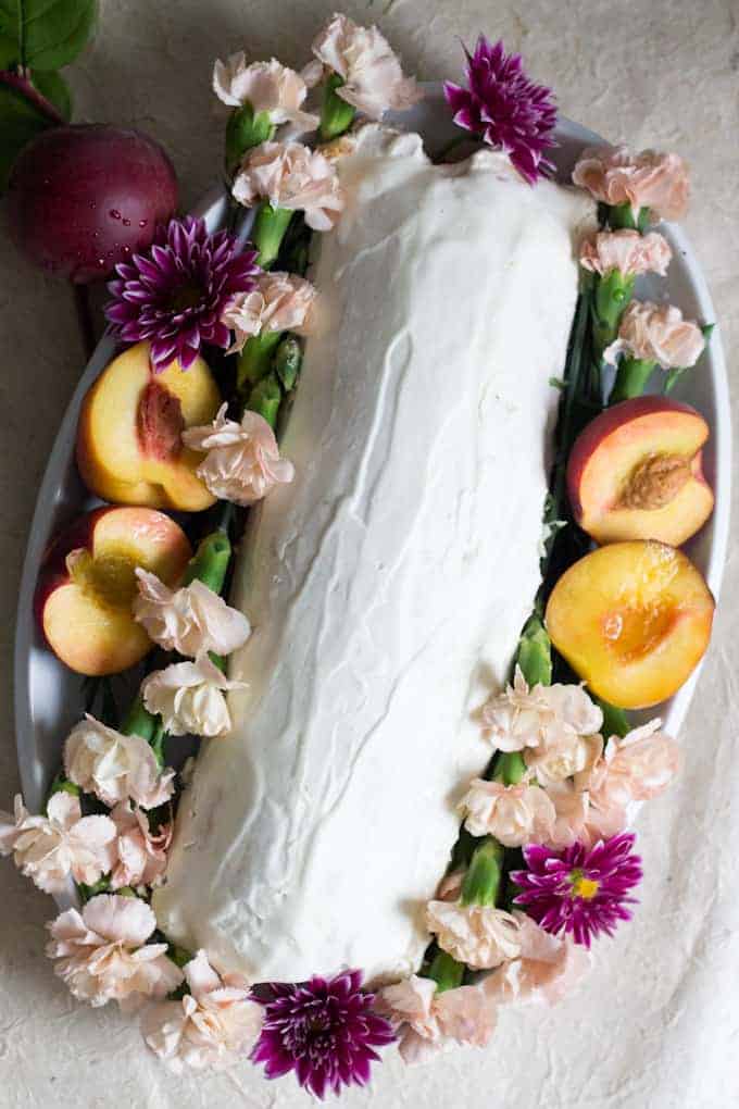 This gluten-free peach swiss roll cake is beautiful and special and oh-so-quaint, like a vision from the ’80s making its way into modern life.