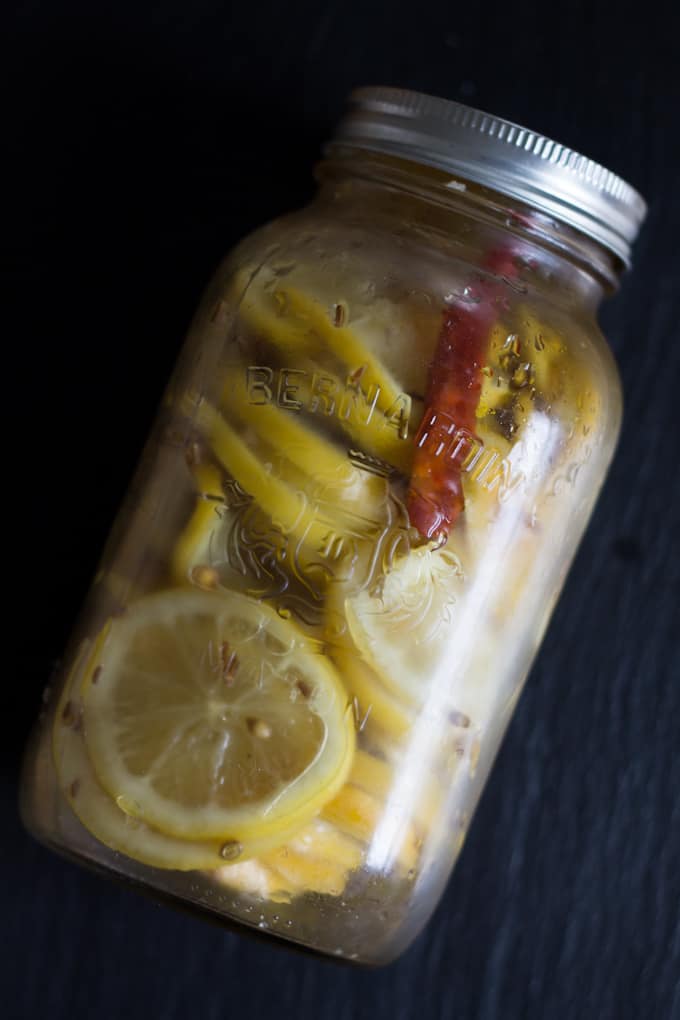 These spiced preserved lemons swim in a heady combination of chunky salt, fiery dried chilies, fragrant whole coriander seeds, and earthy whole cumin seeds.