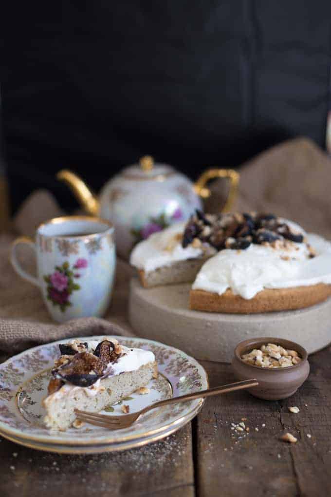 Almond vanilla cake with yogurt crema, caramelized figs and hazelnuts