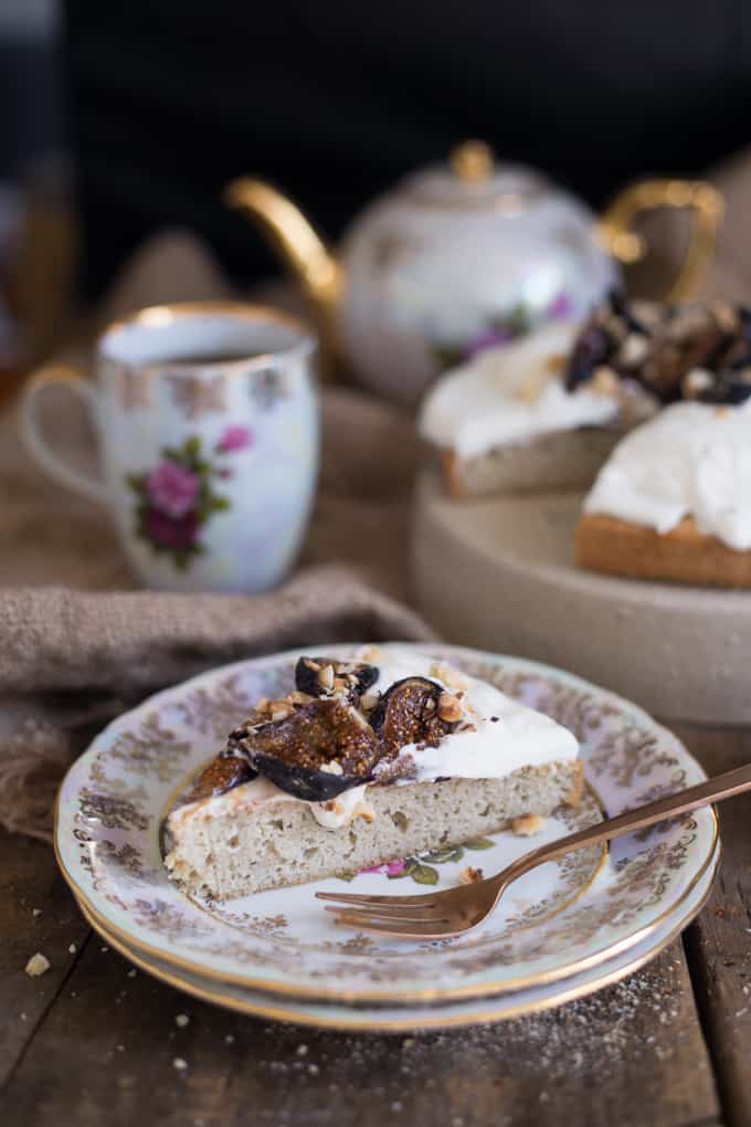 Almond vanilla cake with yogurt crema, caramelized figs and hazelnuts