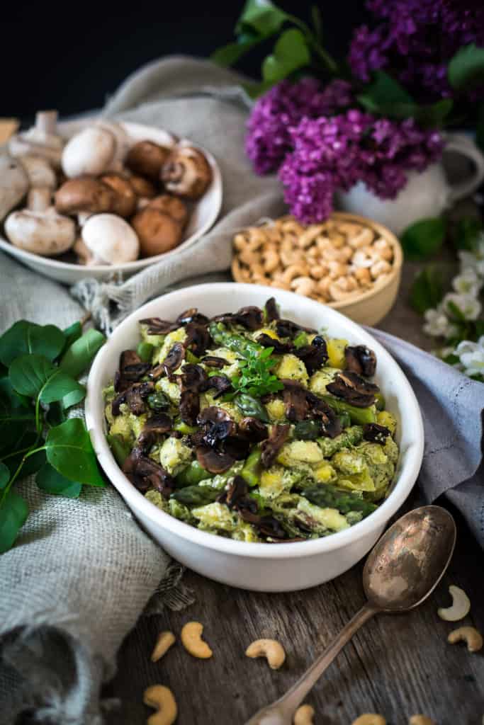 Vegan mushroom and cashew risotto served in a white bowl.