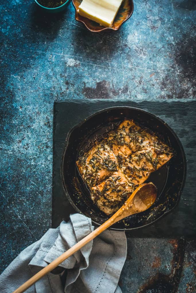 pan-fried Sockeye salmon recipe with mustard, honey and wild herbs with spoon