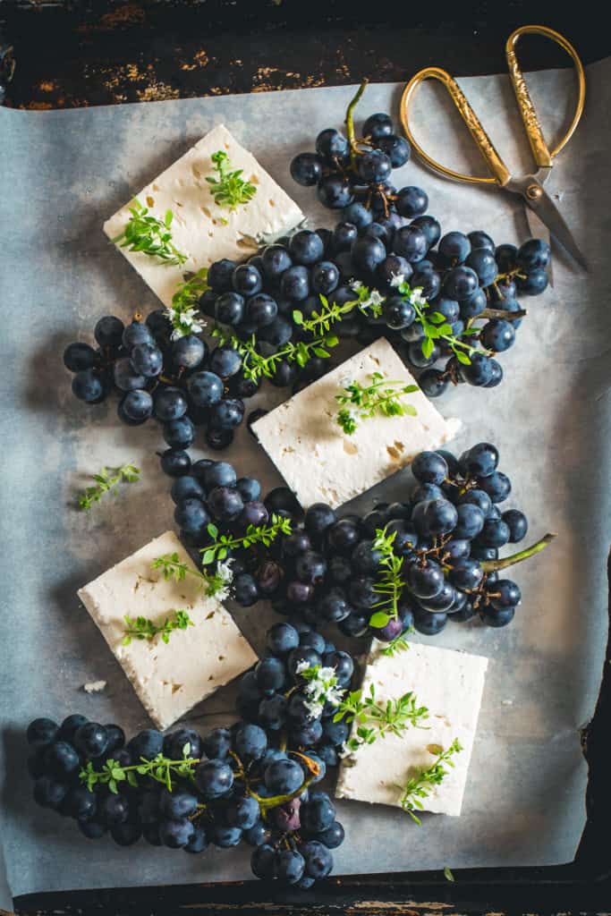 Tray with fresh feta and grapes