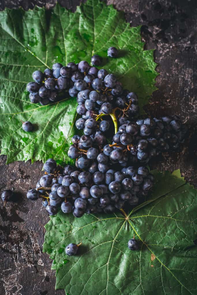 Grapes on grape leaves