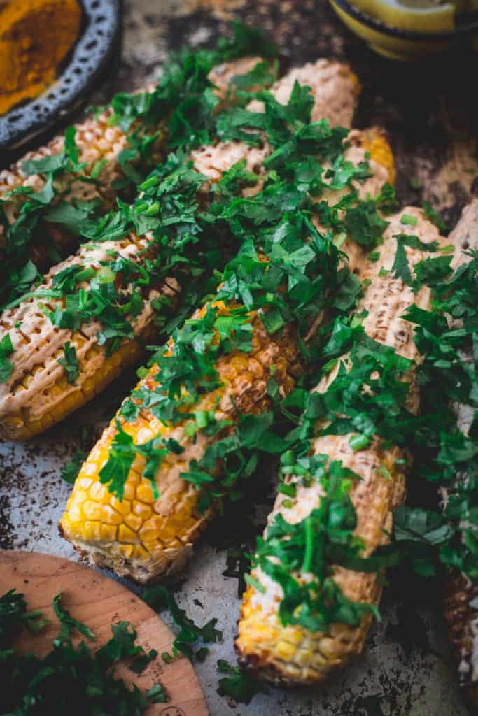 Middle Eastern grilled corn, served, close up