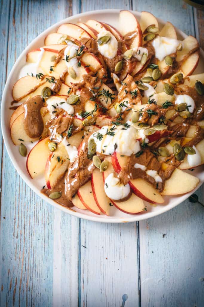 apples with yogurt, almond butter, honey, thyme and pumpkin seeds