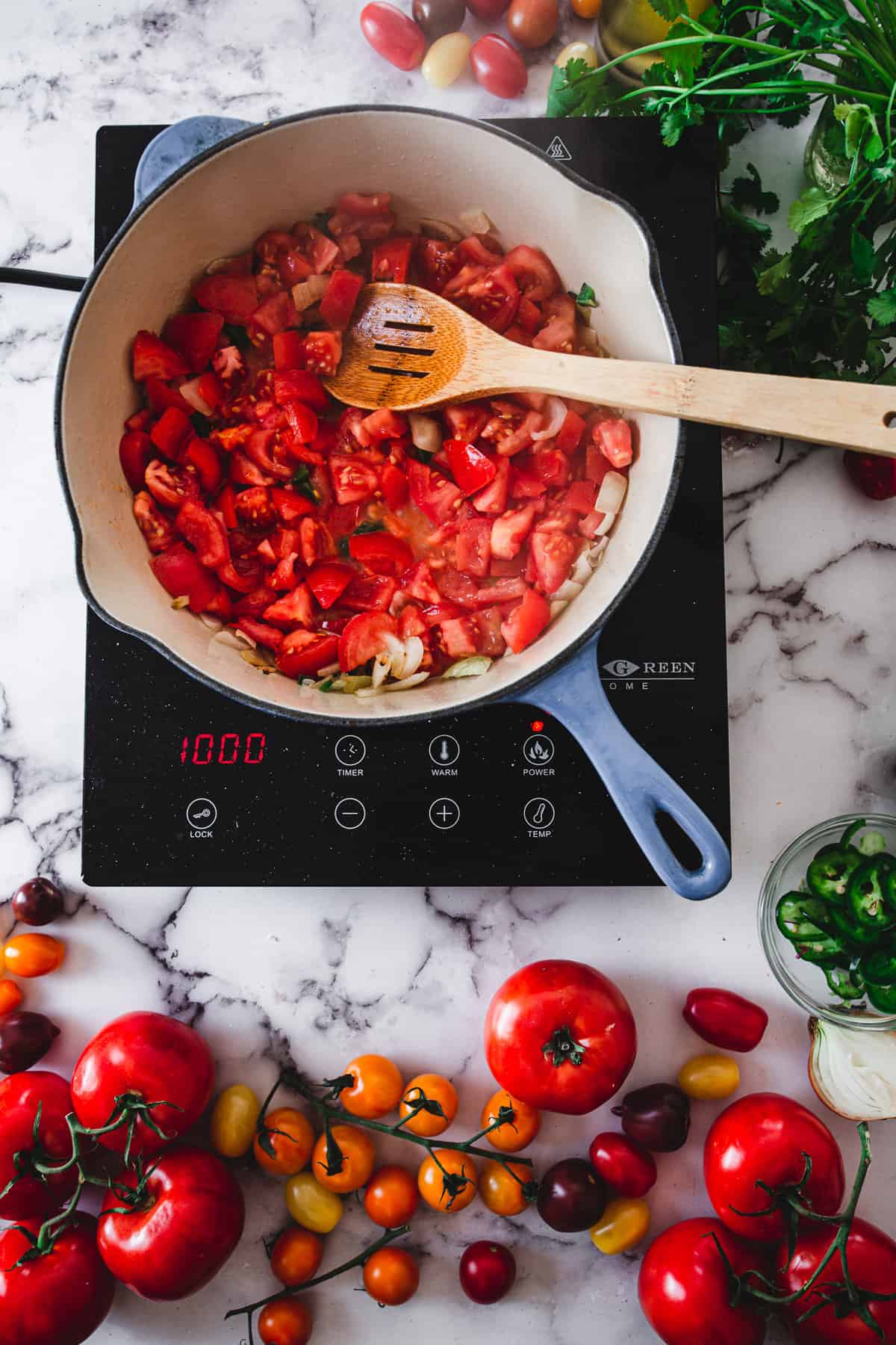 sauteeing tomato sauce for shakshuka