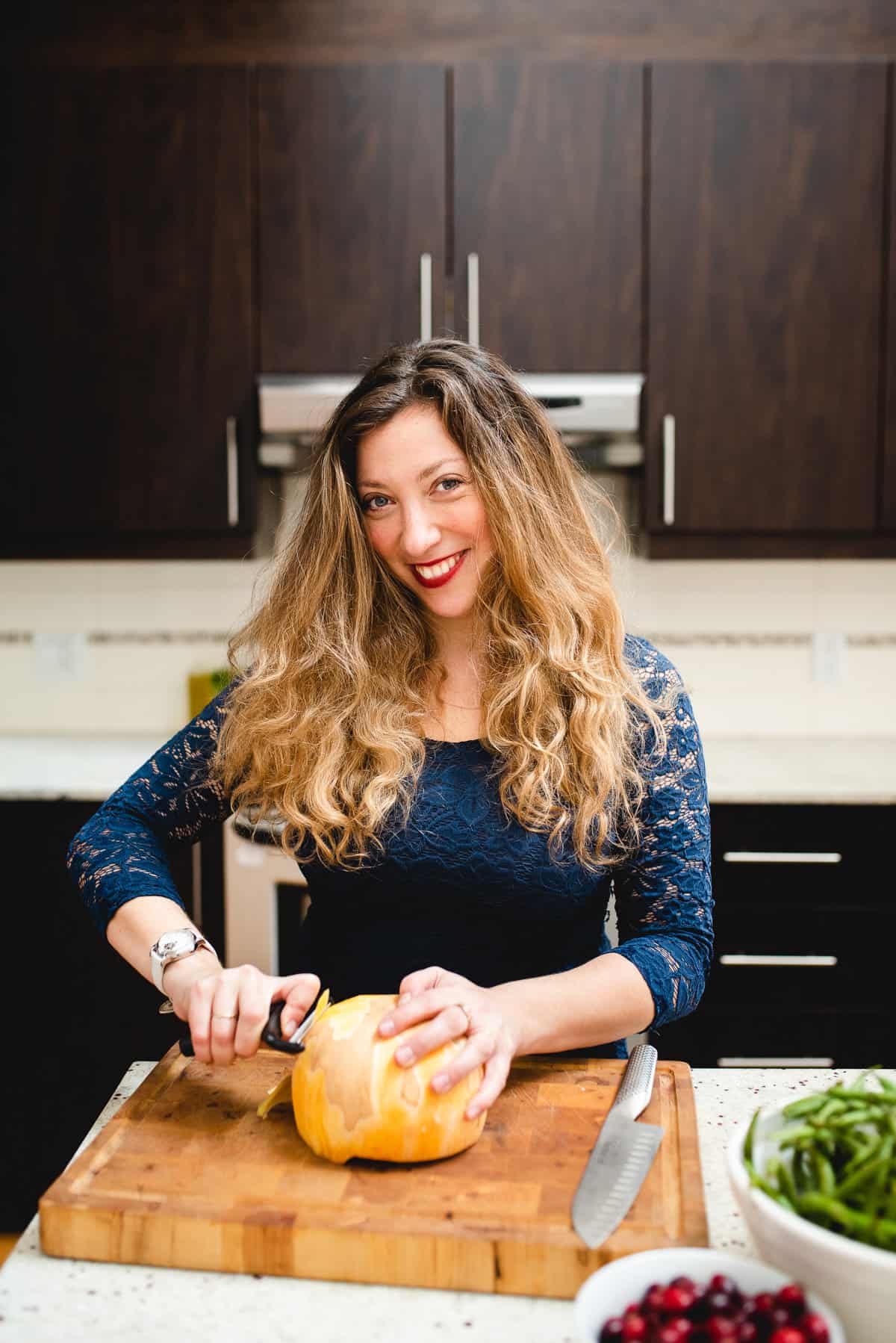 peeling squash on cutting board