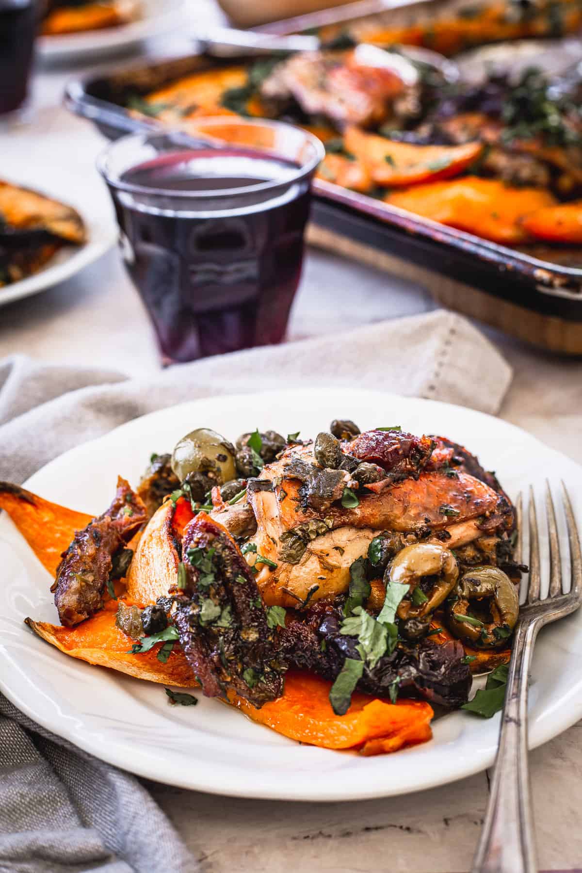 serving of chicken and sweet potatoes with wine