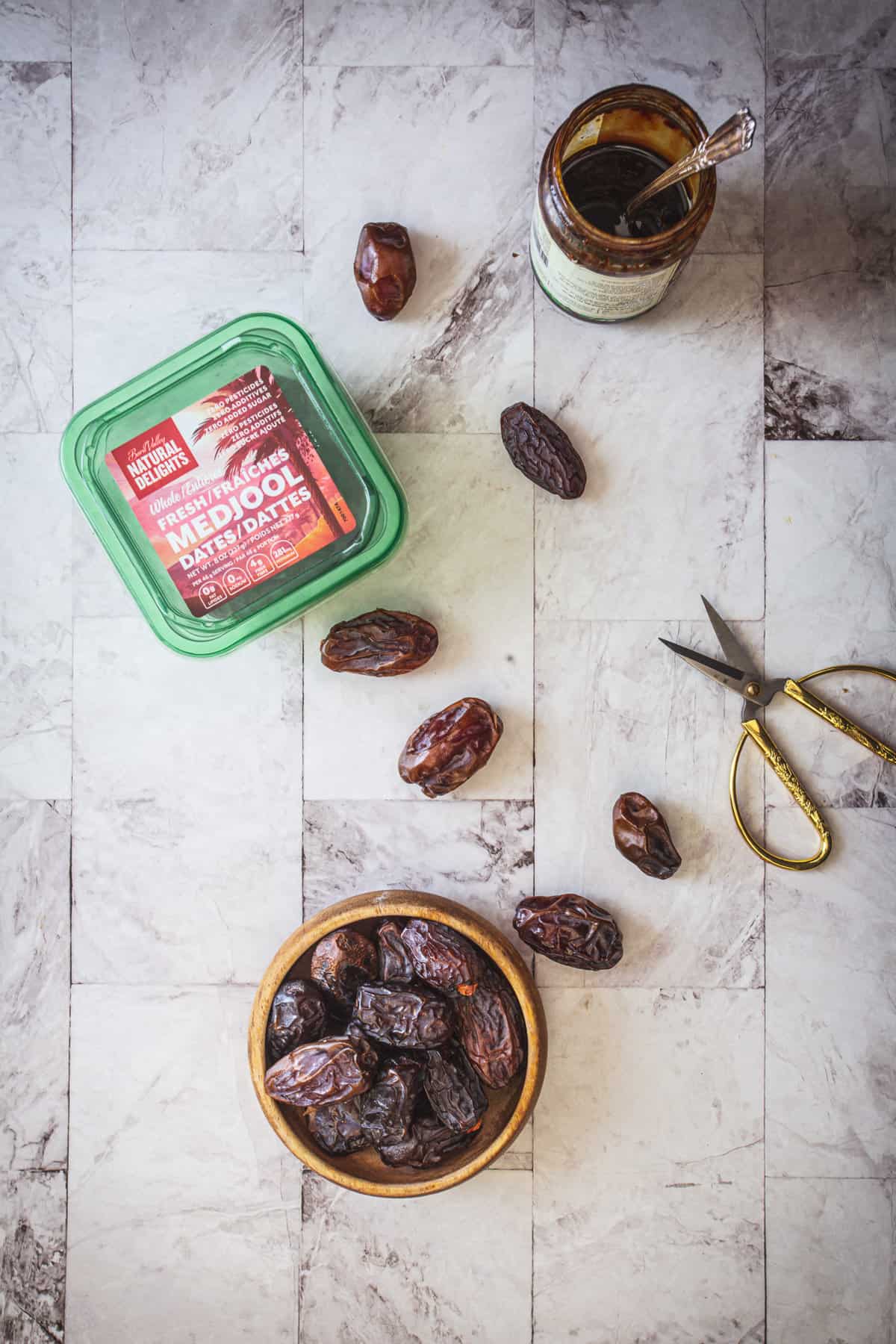 Natural Delights Medjool Dates box and bowl with date molasses