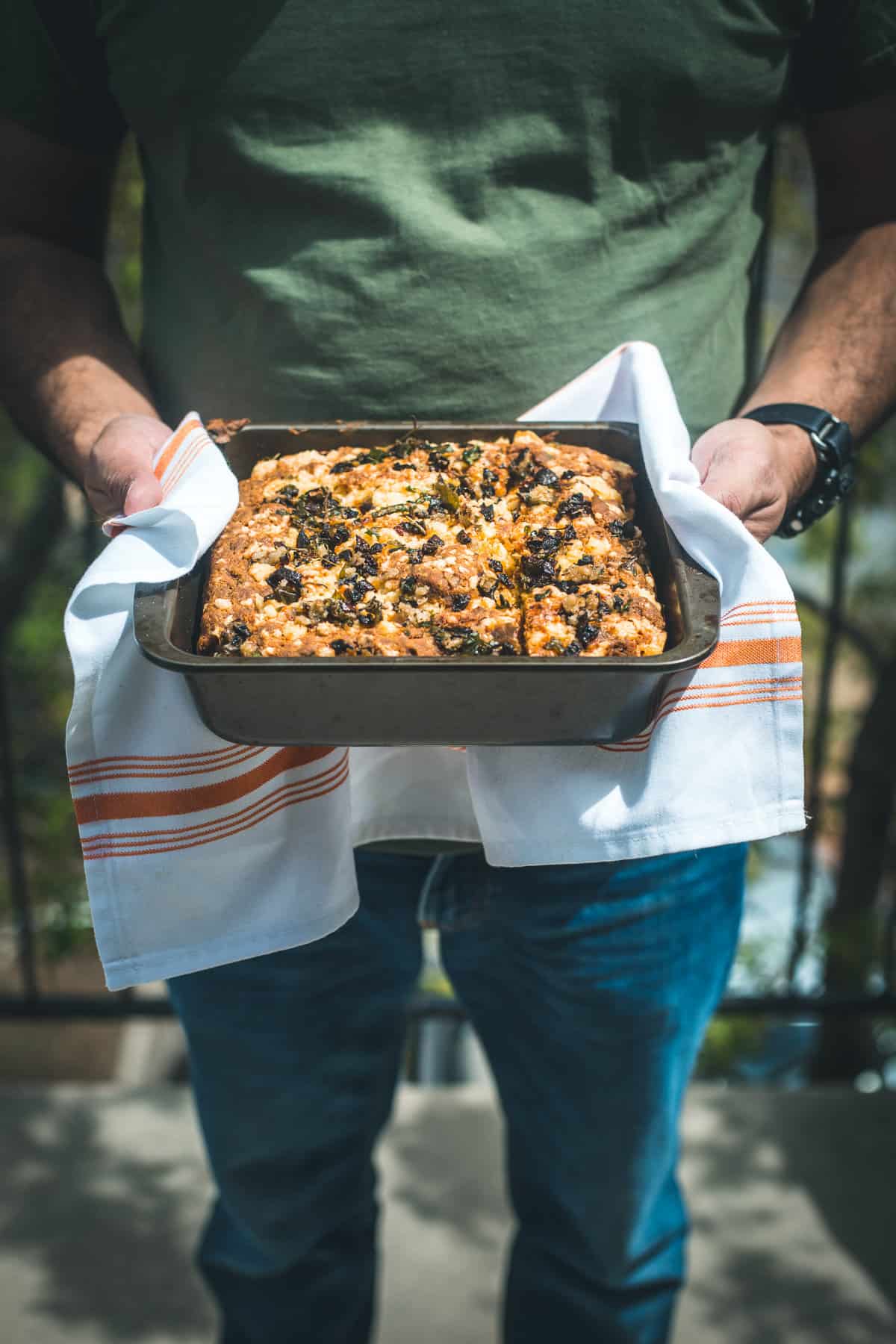 man holding gluten free cornbread tray