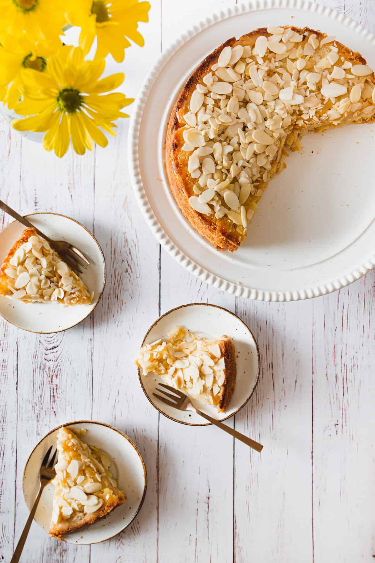 three slices of apple cake with cut cake