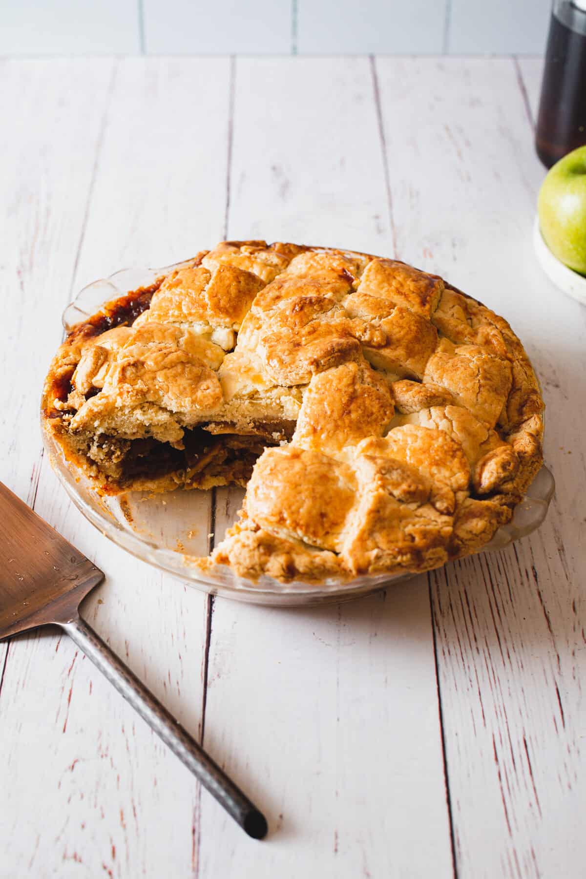 close up on gluten free apple pie with a slice cut