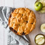 A gluten-free apple pie on a wooden table.