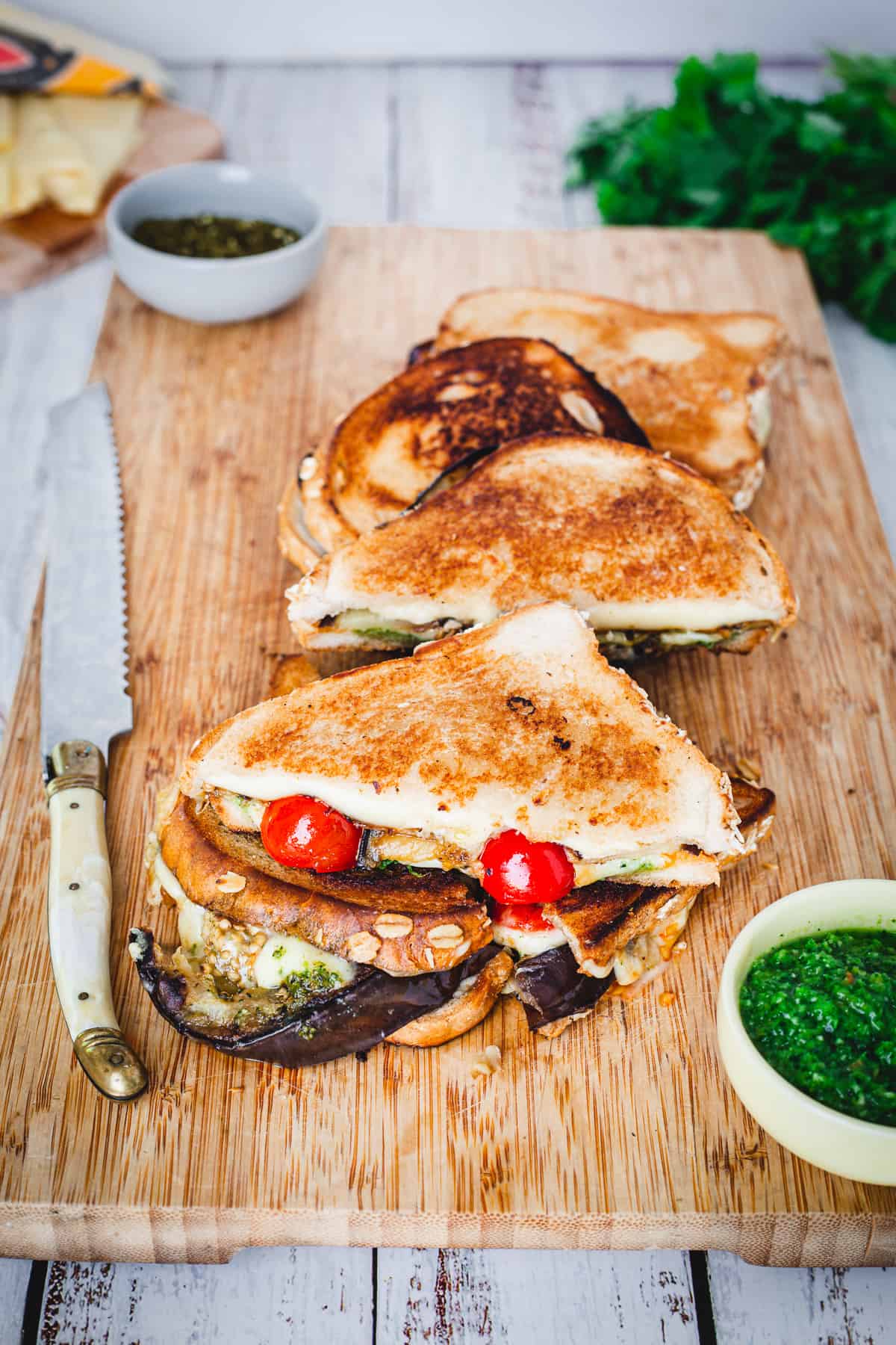 grilled cheese on board with yemenite hot sauce