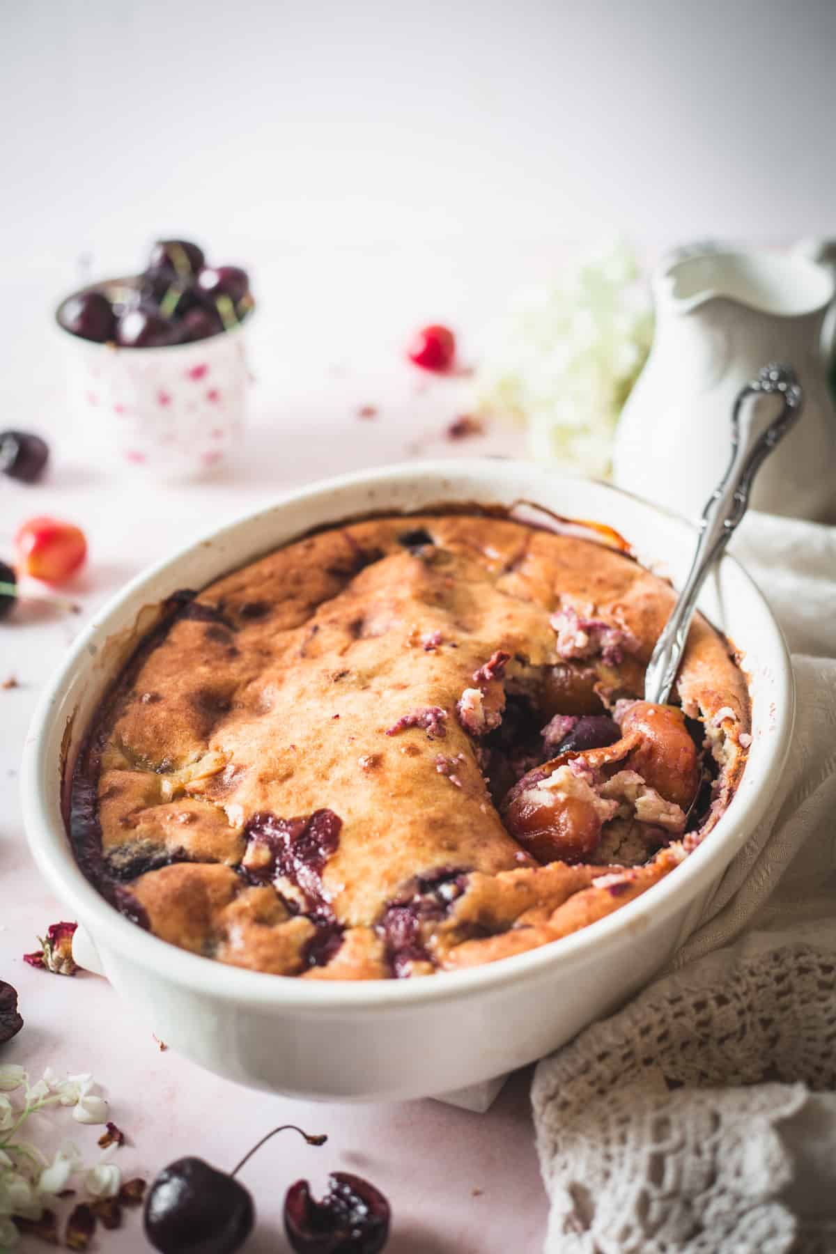 gluten free cherry cobbler with serving spoon
