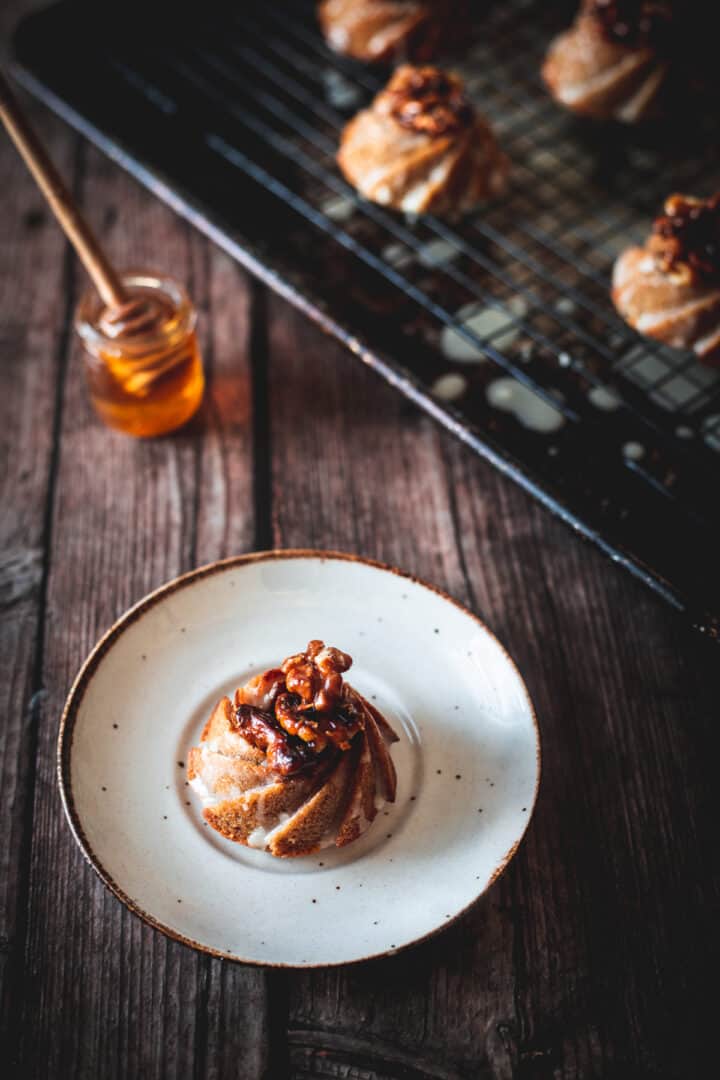 mini gluten free honey cake on plate with honey