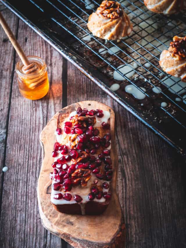 A loaf of bread with pomegranate and honey.