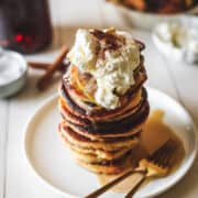Low-carb pancakes are cloud-like and utterly satisfying, topped with healthy caramelized apples sprinkled with cinnamon and coconut sugar. A paleo breakfast that will spring you into the new year, without compromising flavor.