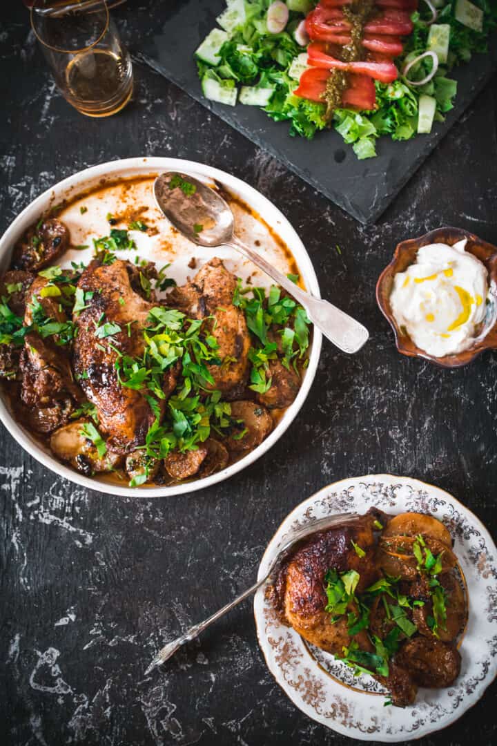 baked buttermilk chicken and potatoes, chicken on a plate and sour cream and salad