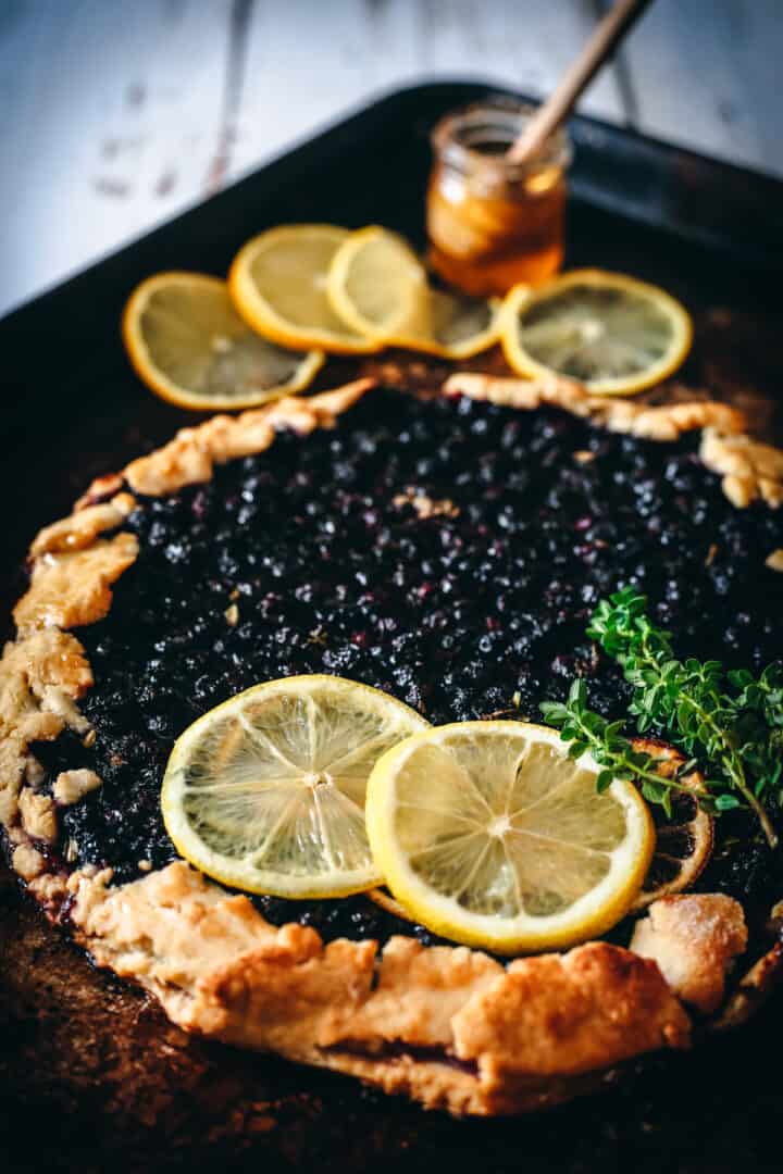 45 degree view of blueberry lemon galette on baking sheet