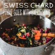 sauteed swiss rainbow chard in a big pan with an orange spatula