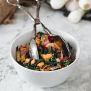sauteed rainbow chard in bowl with silver thongs